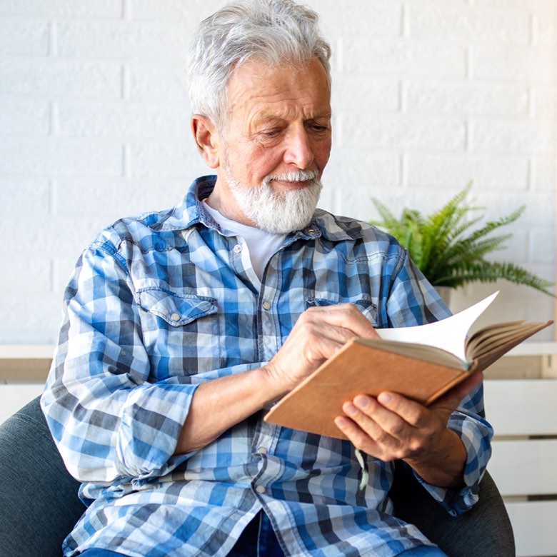 Man reading a journal