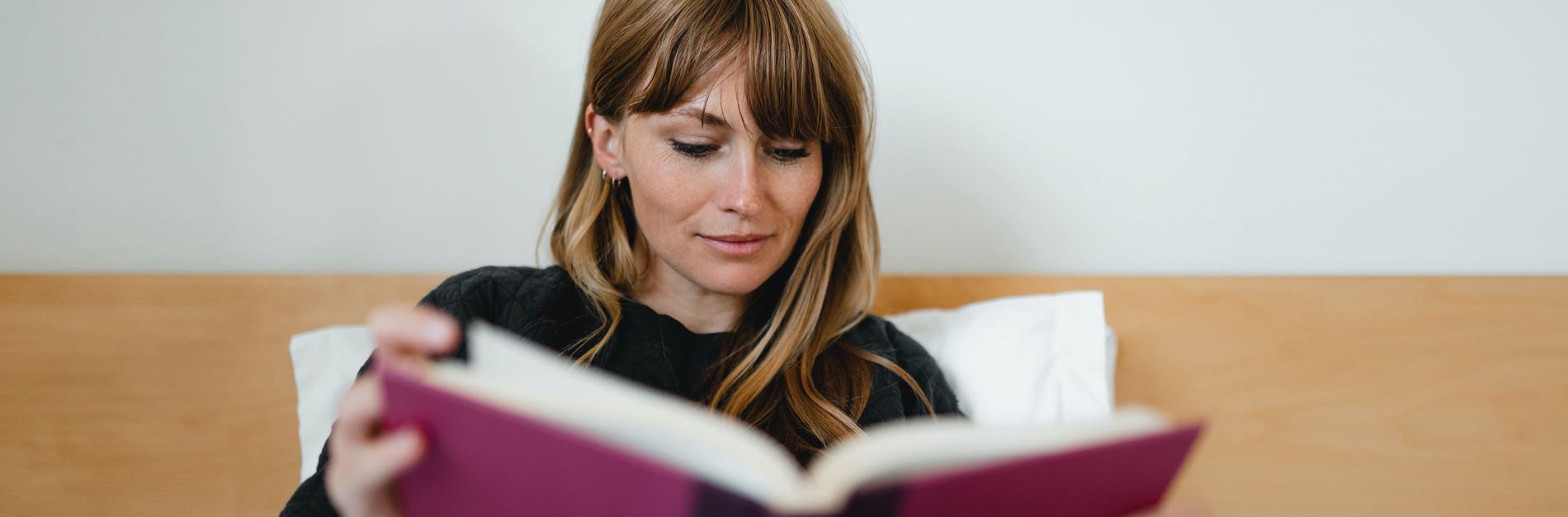 Woman reading at a residence